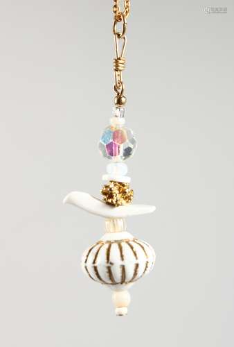 A VINTAGE DESIGNER RALPH MASSEY (born 1938) PORCELAIN FOB and chain.