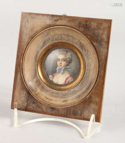 AFTER DE GREUZE. A CIRCULAR PORTRAIT MINIATURE OF A YOUNG LADY in a wooden frame, see reverse. 1.