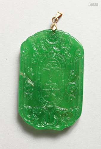 AN APPLE GREEN JADE PENDANT. 2.25ins diameter.