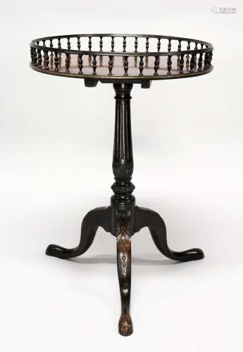 A GOOD GEORGE III CIRCULAR TOP WINE TABLE with pierced gallery, carved column on tripod legs. 2ft