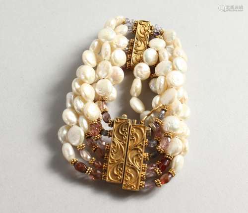 A PEARL BRACELET with decorative clasp.