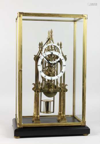 A GOOD MODERN SKELETON CATHEDRAL CLOCK with enamel chapter rings in a glass case. 21.5ins high.