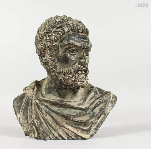 AFTER THE ANTIQUES, A CAST BRONZE BUST OF A MAN, with a toga draped across his shoulder. 8.5ins