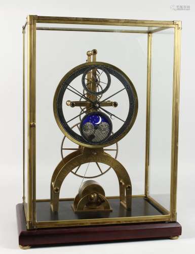 A GOOD MODERN MOONPHASE SKELETON CLOCK, in a glass display case. 21ins high.
