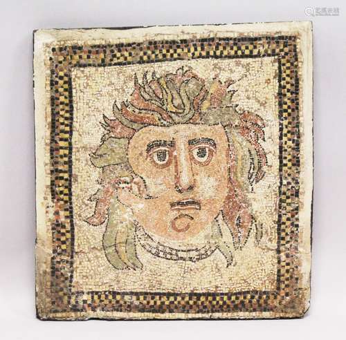 A SMALL RUSSIAN MOSAIC STONEWARE PANEL depicting a head. 1ft 9in x 1ft 8ins.