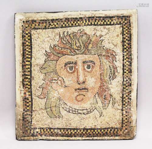 A SMALL RUSSIAN MOSAIC STONEWARE PANEL depicting a head. 1ft 9in x 1ft 8ins.