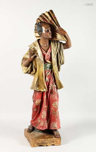 A LARGE ORIENTAL POTTERY STANDING FIGURE OF A MAN holding a large fan. 40ins high.