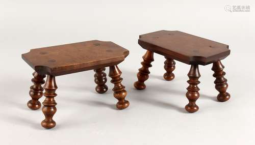 A PAIR OF WOODEN CANDLE STANDS on turned legs. 6ins.