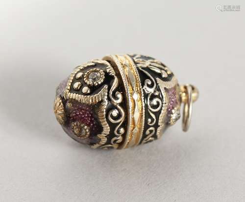 A RUSSIAN SILVER AND ENAMEL MINIATURE EGG SHAPED PENDANT.