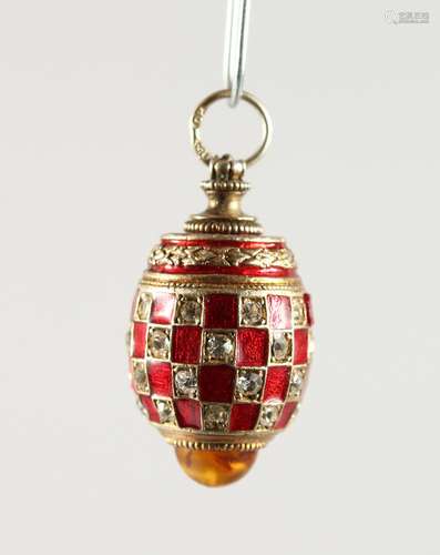 A RUSSIAN SILVER AND ENAMEL MINIATURE EGG SHAPED PENDANT.