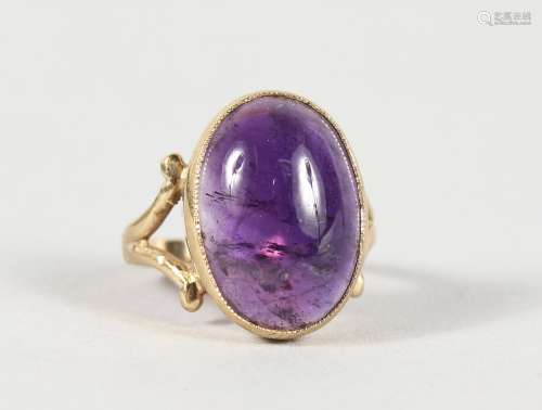 A 9CT GOLD AND LARGE AMETHYST RING.