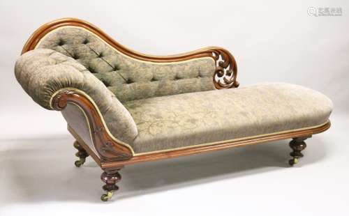 A VICTORIAN MAHOGANY CHAISE LONGUE, with carved and pierced frame, on turned and carved feet with