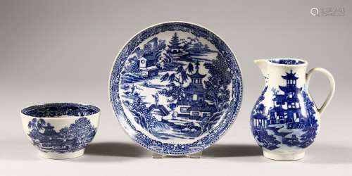 A WILLOW PATTERN BLUE AND WHITE TEA BOWL AND SAUCER, unusual mark, and A SPARROW BEAK JUG. (3)