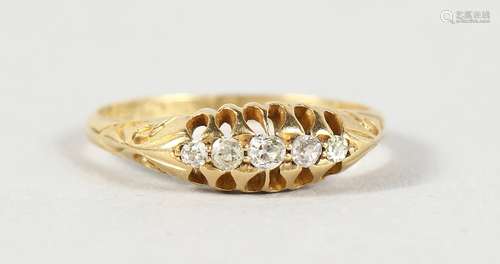 AN 18CT GOLD FIVE STONE DIAMOND RING.