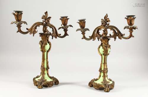 A GOOD PAIR OF 19TH CENTURY FRENCH ORMOLU AND GREEN PORCELAIN TWO-LIGHT CANDLESTICKS. 13ins high.