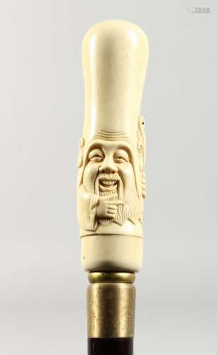 A WALKING STICK the bone handle carved as a Chinaman.