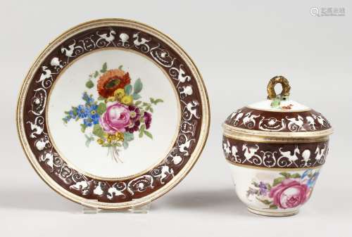 A DRESDEN CUP, COVER AND SAUCER, with a raised border of animals and painted with flowers. A.R. in