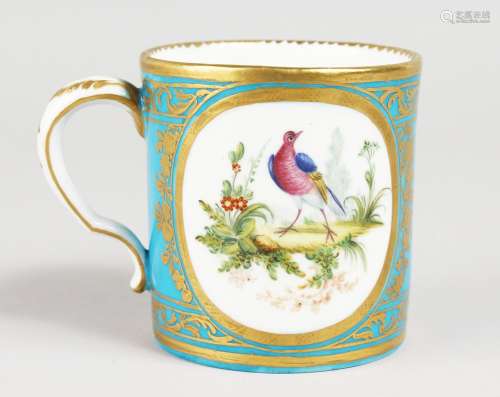 AN 18TH CENTURY SEVRES BLUE CELESTE MUG, painted with two oval landscapes, both containing birds