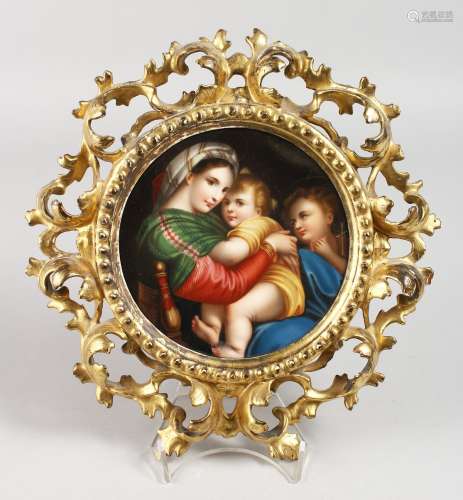 A GOOD DRESDEN CIRCULAR PLAQUE, Mother and two children 5.5ins diameter, in an Italian gilt frame.