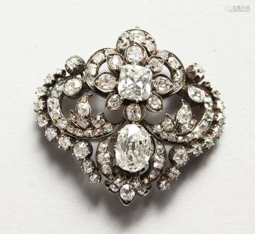A SUPERB OLD CUT DIAMOND BROOCH of CIRCA 1880, with two large diamonds surrounded by approx.