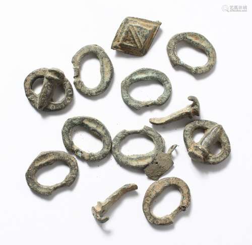 A BAG OF SMALL ROMAN BUCKLES.