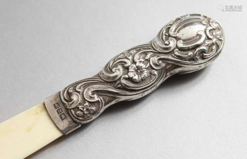 A VICTORIAN SILVER MOUNTED PAPER KNIFE. Birmingham 1894. 8ins long.