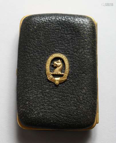 A VICTORIAN LEATHER GILT MOUNTED PURSE by COOK, 8 Clifford Street, with crest. 3.5ins x 2.25ins.