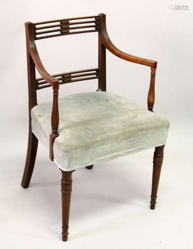 A GEORGE III MAHOGANY CARVER/DESK CHAIR, with two rows of pierced bars, reeded arms, overstuffed