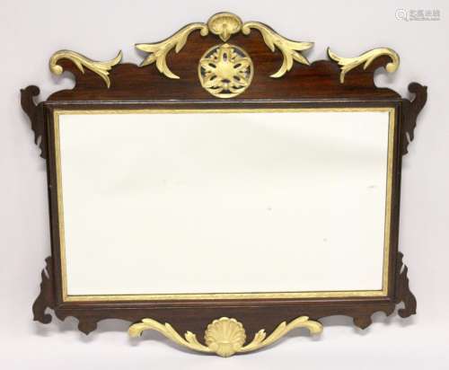 A GOOD GEORGE III DESIGN MAHOGANY FRETWORK FRAME WALL MIRROR, with pierced, carved and gilded frame.