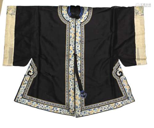 A Chinese textile, blue/black gown decorated with white ground floral rims; sleeve width about 50 cm