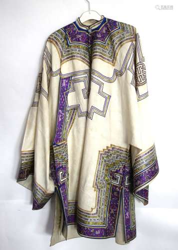 An elegant Chinese [or other Asian] off-white ground robe with wide sleeves, purple-ground facings