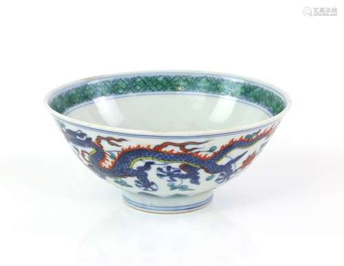 An underglaze blue and doucai style decorated bowl, designed with five clawed dragons on the