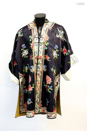 An elegant Chinese textile jacket with Imperial-Yellow lining and white-ground cuffs; overall length