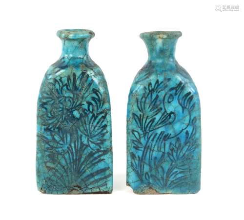 A pair of Raqqa style bottle vases; each one with unglazed base and decorated in black on the