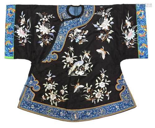 A Chinese textile jacket with blue-ground facings and floral designs; width of sleeves about 45