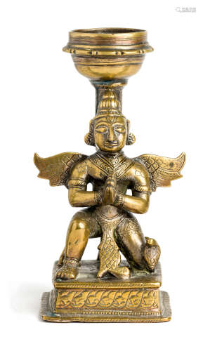 A BRASS STAND IN THE FORM OF GARUDA, INDIA, 19TH CENTURY
