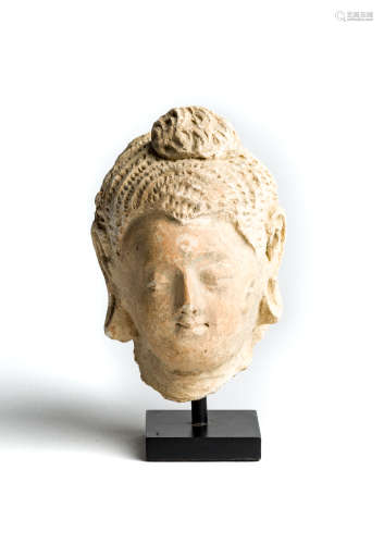 A GANDHARA STUCCO FRAGMENTARY HEAD OF BUDDHA, NORTH-WEST FRONTIER REGION, PAKISTAN, 4TH/5TH CENTURY