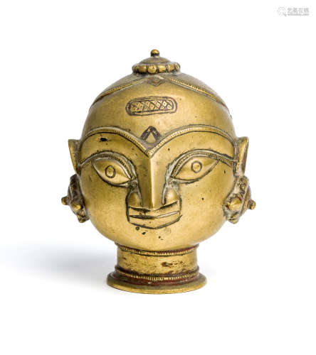 A BRASS GAURI HEAD, WESTERN INDIA, 19TH CENTURY