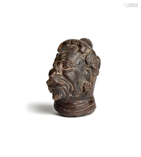 A MAJAPAHIT TERRACOTTA HEAD OF HANUMAN, JAVA, CIRCA 14TH CENTURY