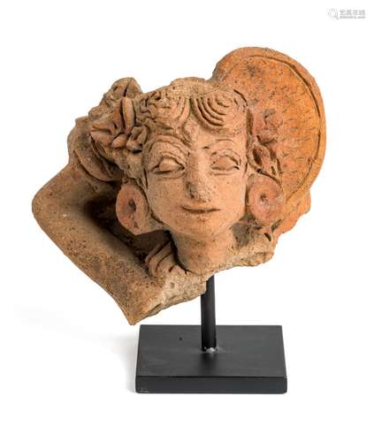 A MAJAPAHIT TERRACOTTA FRAGMENTARY BUST OF A MAIDEN, JAVA, CIRCA 14TH CENTURY