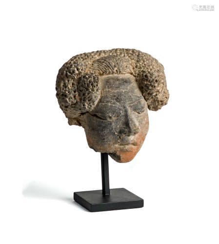 A MAJAPAHIT TERRACOTTA HEAD OF A WOMAN, JAVA, CIRCA 14TH CENTURY