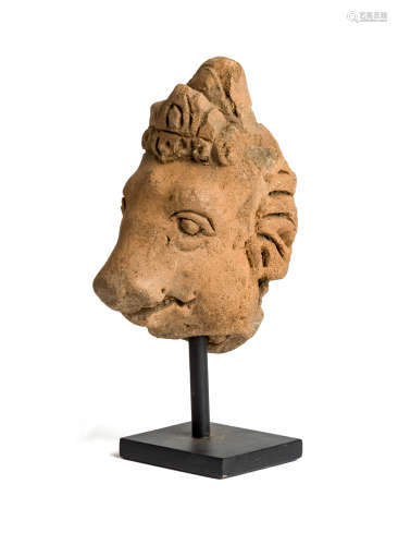 A MAJAPAHIT FRAGMENTARY TERRACOTTA HEAD OF VARAHA, JAVA, CIRCA 14TH CENTURY