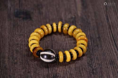 A Tibetan Amber Bracelet With Dzi