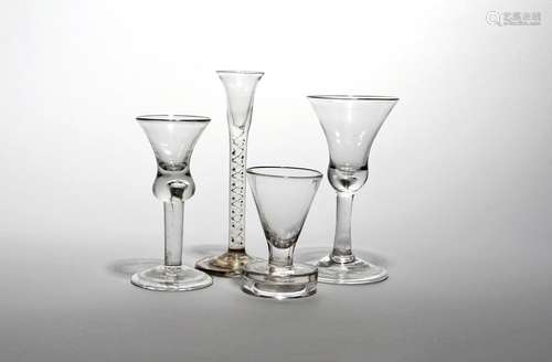 A cordial glass c.1750, with narrow bell bowl over an airtwist stem, a gin glass on a plain stem,