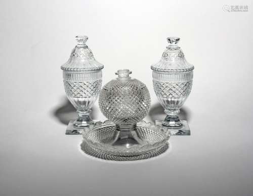 A pair of cut glass sweetmeat jars and covers 19th century, cut with diamond hobnail bands and
