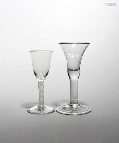 Two wine glasses c.1750-60, one with a bell bowl raised on a thick plain above a folded foot, the