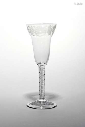 A large pan-topped wine glass c.1760, the generous bowl engraved below the rim with a continuous