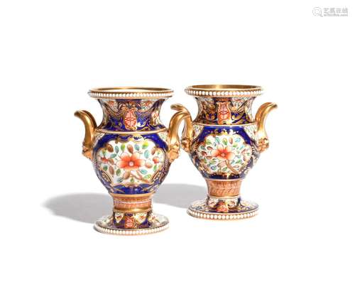 A pair of Spode two-handled vases c.1820-30, the baluster forms decorated in the Imari palette