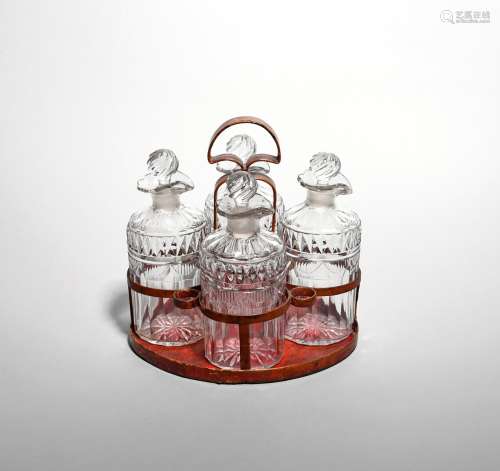 A set of four small cut glass spirit decanters and stoppers 19th century, of slightly flattened