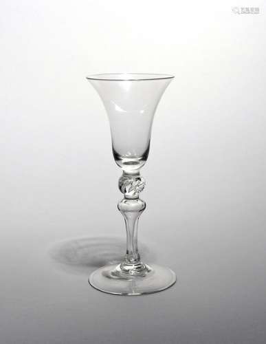 A Newcastle light baluster glass mid 18th century, with a bell bowl raised on a slender baluster